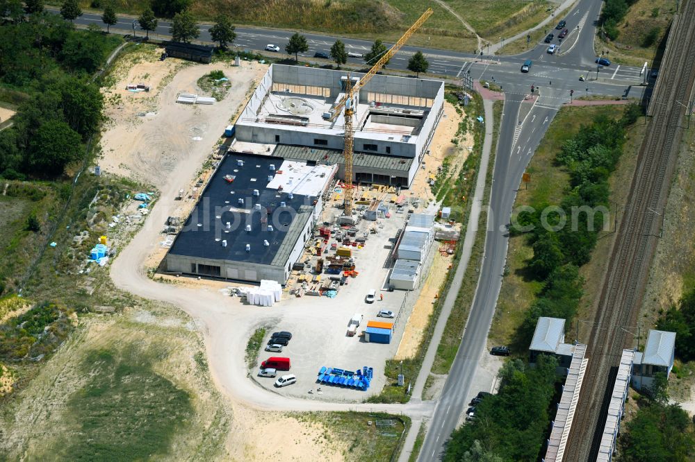 Aerial photograph Falkensee - Construction site for the new building of the indoor swimming pool on street Seegefelder Strasse in Falkensee in the state Brandenburg, Germany