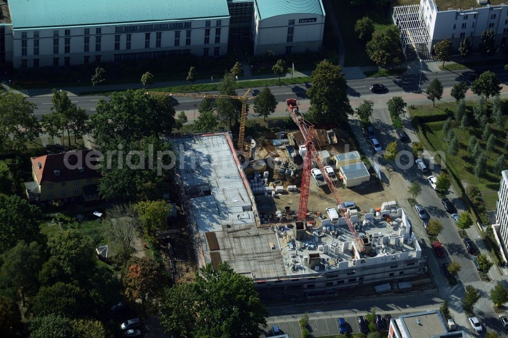 Potsdam from the bird's eye view: Construction site for the new building of a elderly care centre in Potsdam in the state of Brandenburg. Vitanas Senioren Centrum Am Volkspark is being developed on Pappelallee