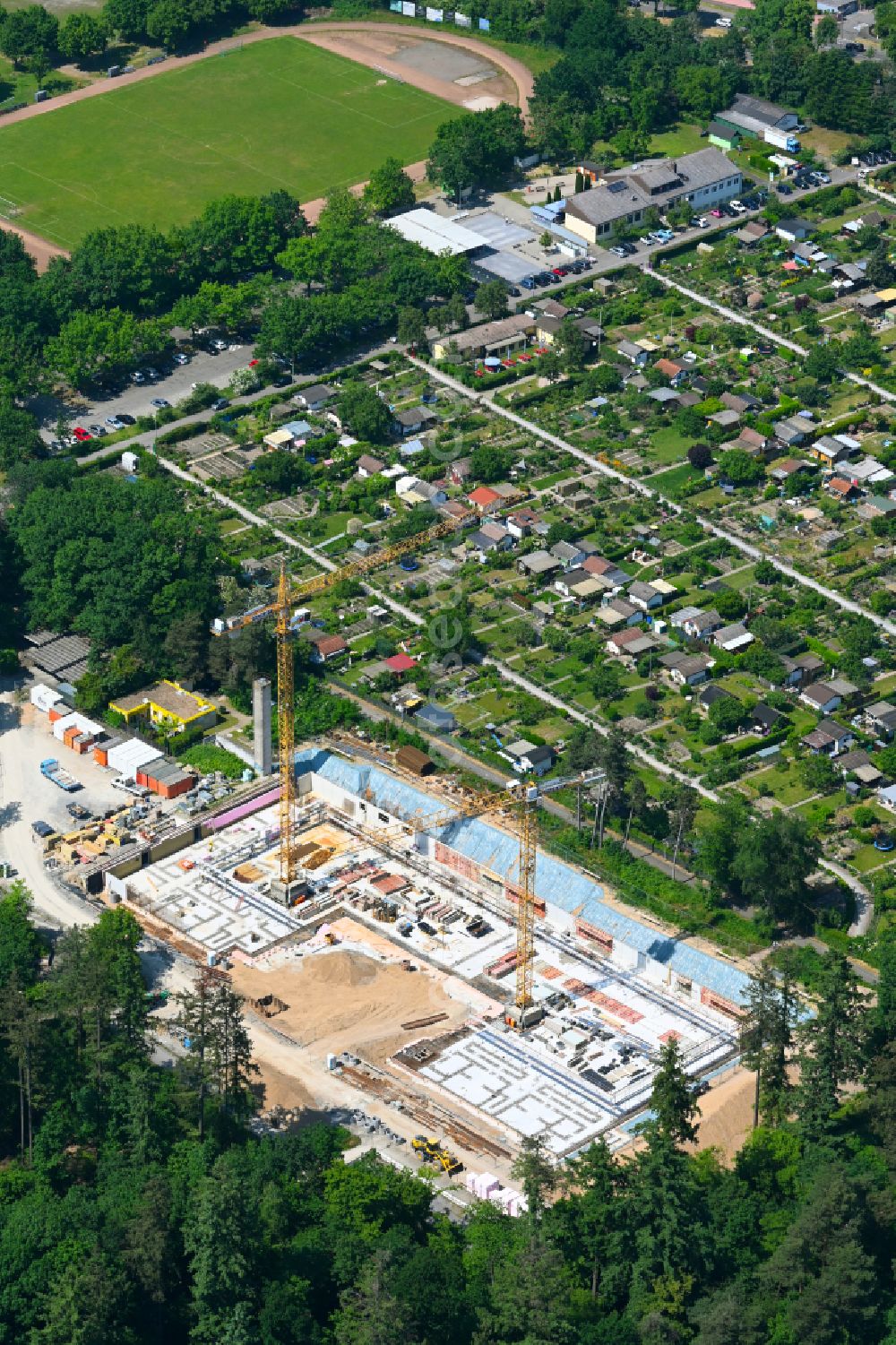 Karlsruhe from the bird's eye view: Construction site for the new construction of the gym and sports hall - three-field sports hall at the Engelbert-Bohn-School on street Joachim-Kurzaj-Weg in the district Oberreut in Karlsruhe in the state Baden-Wuerttemberg, Germany