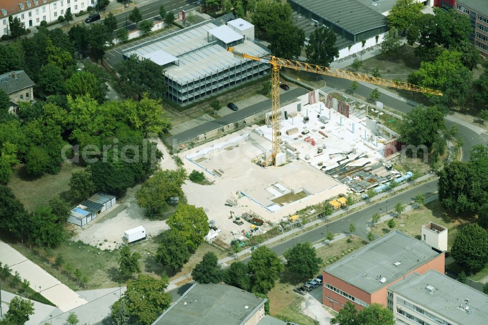 Potsdam from the bird's eye view: Construction site for the new sports hall on corner Olympischer Weg in Potsdam in the state Brandenburg, Germany