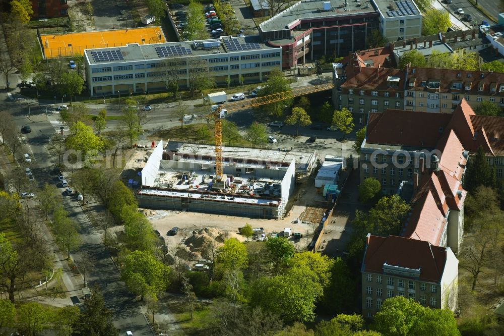 Berlin from the bird's eye view: Construction site for the new building of the gymnasium and sports hall at the Lily-Braun-Gymnasium on Galenstrasse in the district of Spandau in Berlin, Germany