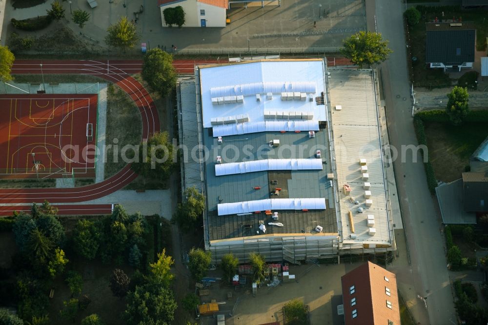 Fredersdorf-Vogelsdorf from the bird's eye view: Construction site for the new sports hall on Tieckstrasse in Fredersdorf-Vogelsdorf in the state Brandenburg, Germany