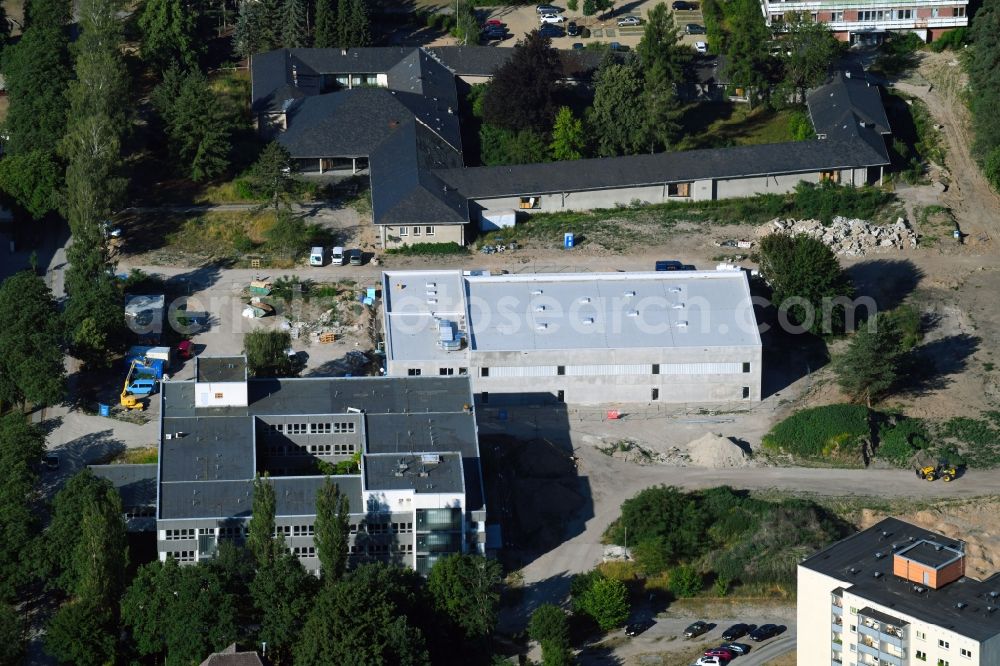 Berlin from the bird's eye view: Construction site for the new sports hall on Poelnitzweg - Wiltbergstrasse in Berlin, Germany