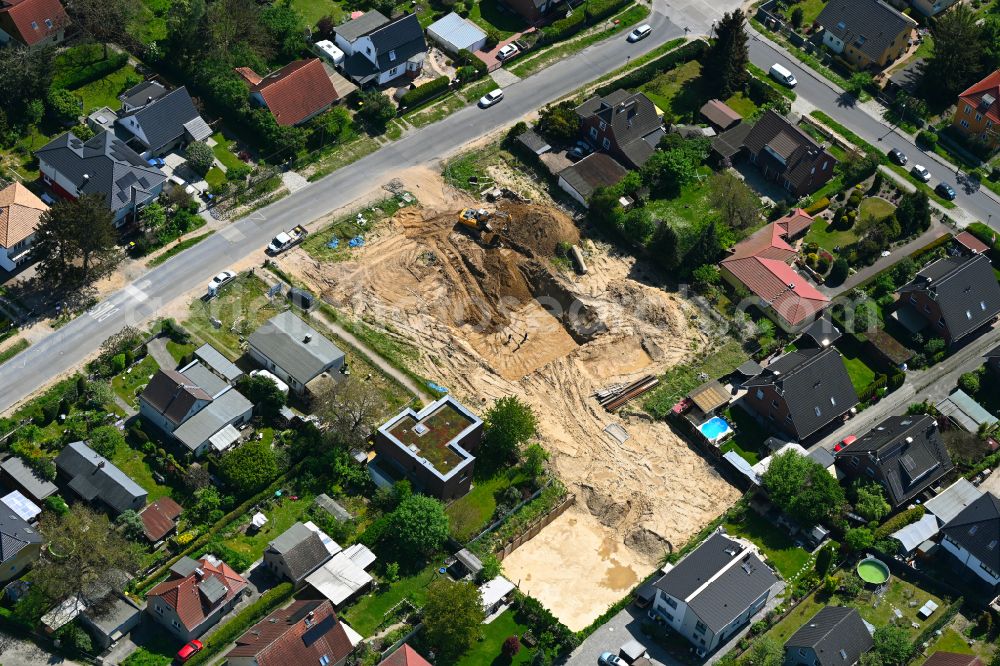 Aerial photograph Berlin - Construction site for the new construction of a multi-family residential building as a townhouse on street Neuenhagener Strasse in the district Mahlsdorf in Berlin, Germany