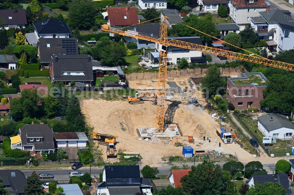 Aerial image Berlin - Construction site for the new construction of a multi-family residential building as a townhouse on street Neuenhagener Strasse in the district Mahlsdorf in Berlin, Germany