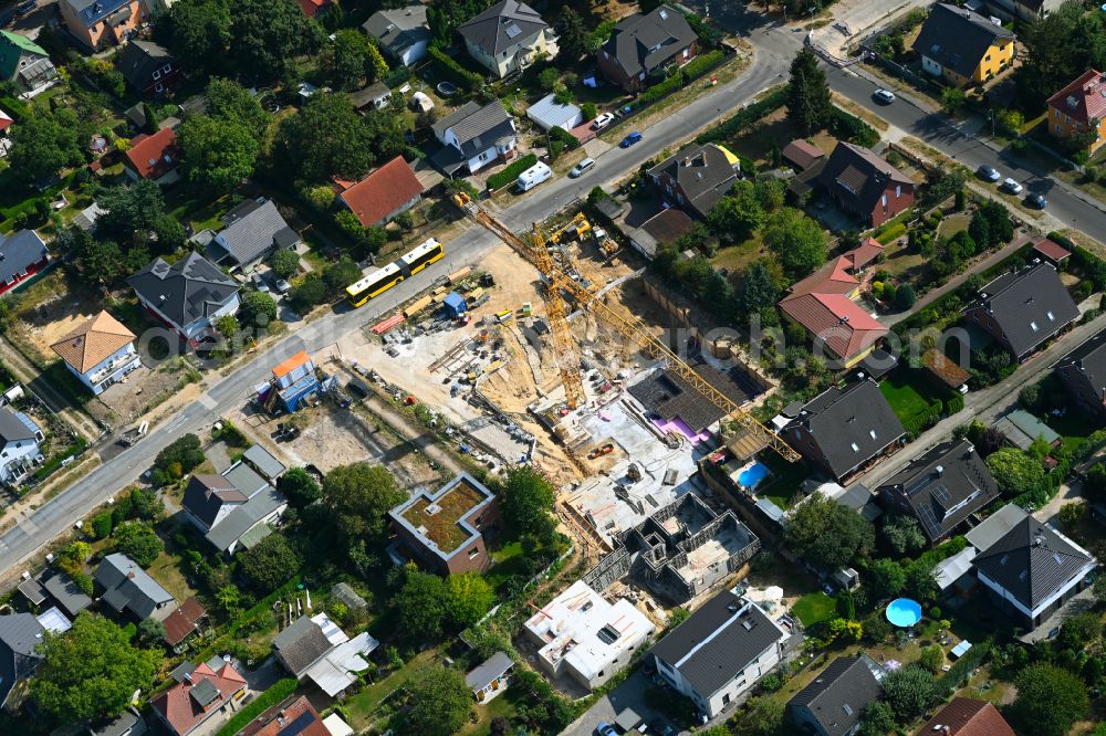 Berlin from the bird's eye view: Construction site for the new construction of a multi-family residential building as a townhouse on street Neuenhagener Strasse in the district Mahlsdorf in Berlin, Germany