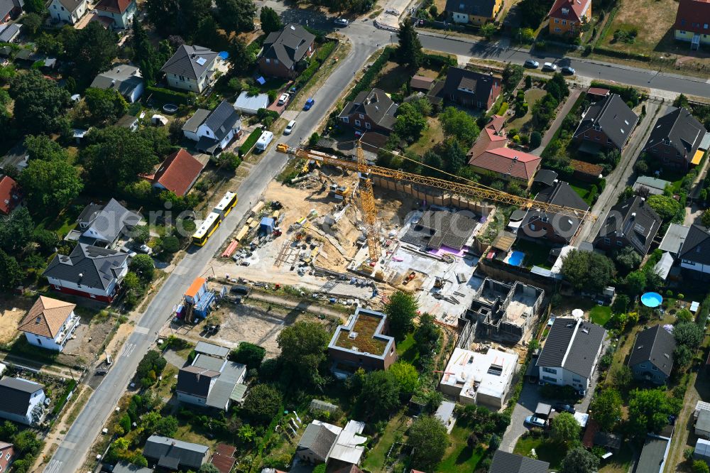 Aerial image Berlin - Construction site for the new construction of a multi-family residential building as a townhouse on street Neuenhagener Strasse in the district Mahlsdorf in Berlin, Germany