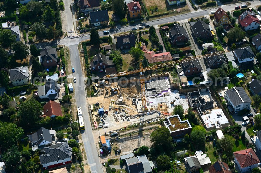 Berlin from the bird's eye view: Construction site for the new construction of a multi-family residential building as a townhouse on street Neuenhagener Strasse in the district Mahlsdorf in Berlin, Germany