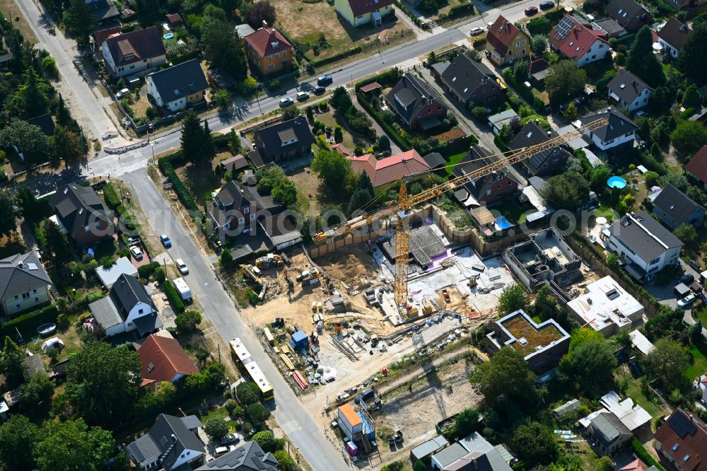 Aerial image Berlin - Construction site for the new construction of a multi-family residential building as a townhouse on street Neuenhagener Strasse in the district Mahlsdorf in Berlin, Germany