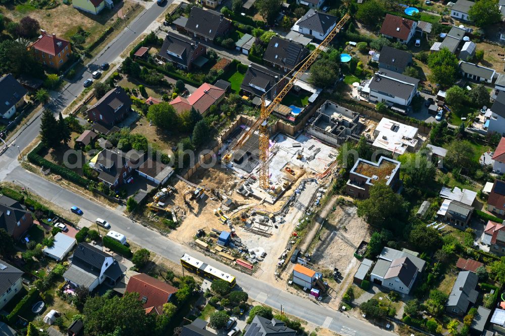 Aerial photograph Berlin - Construction site for the new construction of a multi-family residential building as a townhouse on street Neuenhagener Strasse in the district Mahlsdorf in Berlin, Germany