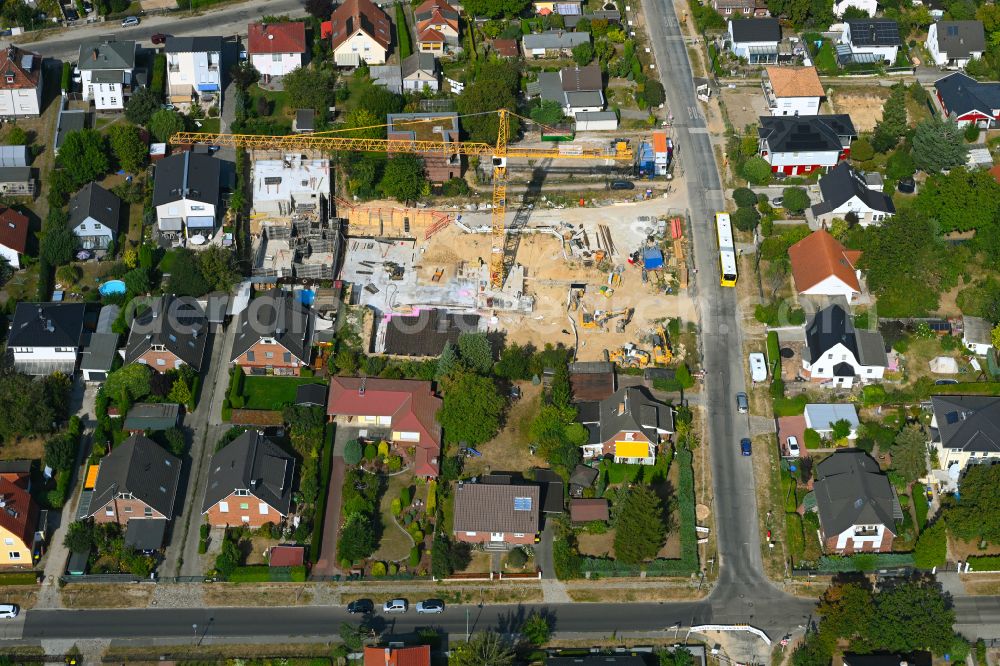 Berlin from the bird's eye view: Construction site for the new construction of a multi-family residential building as a townhouse on street Neuenhagener Strasse in the district Mahlsdorf in Berlin, Germany