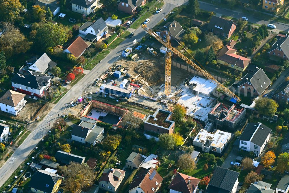 Aerial photograph Berlin - Construction site for the new construction of a multi-family residential building as a townhouse on street Neuenhagener Strasse in the district Mahlsdorf in Berlin, Germany