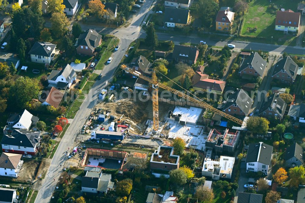 Berlin from above - Construction site for the new construction of a multi-family residential building as a townhouse on street Neuenhagener Strasse in the district Mahlsdorf in Berlin, Germany