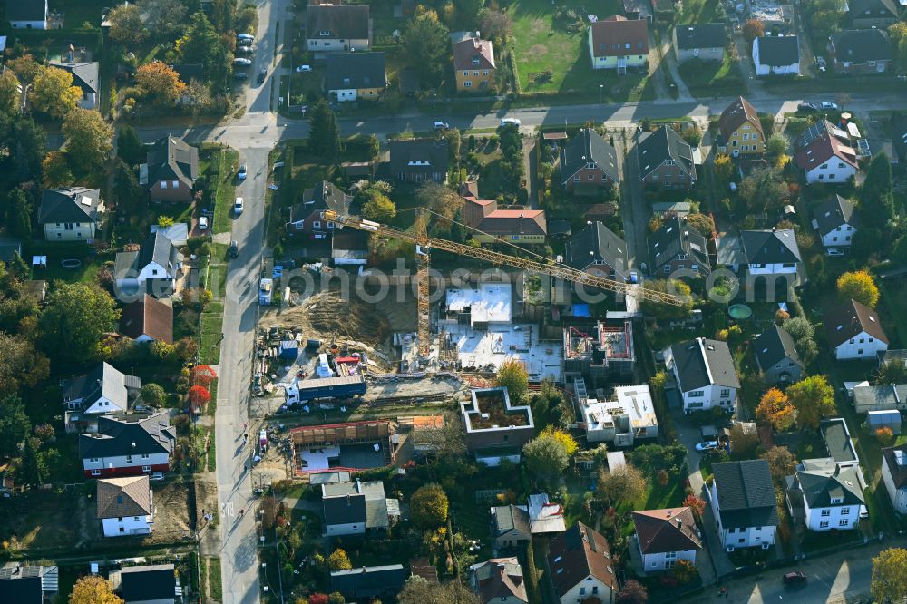 Berlin from the bird's eye view: Construction site for the new construction of a multi-family residential building as a townhouse on street Neuenhagener Strasse in the district Mahlsdorf in Berlin, Germany