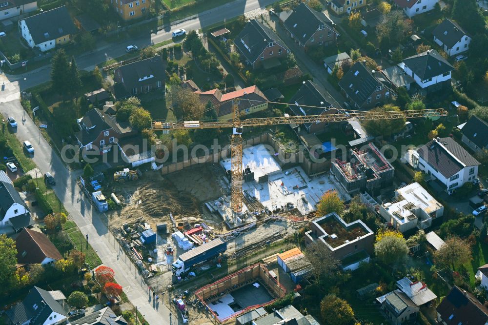 Aerial image Berlin - Construction site for the new construction of a multi-family residential building as a townhouse on street Neuenhagener Strasse in the district Mahlsdorf in Berlin, Germany