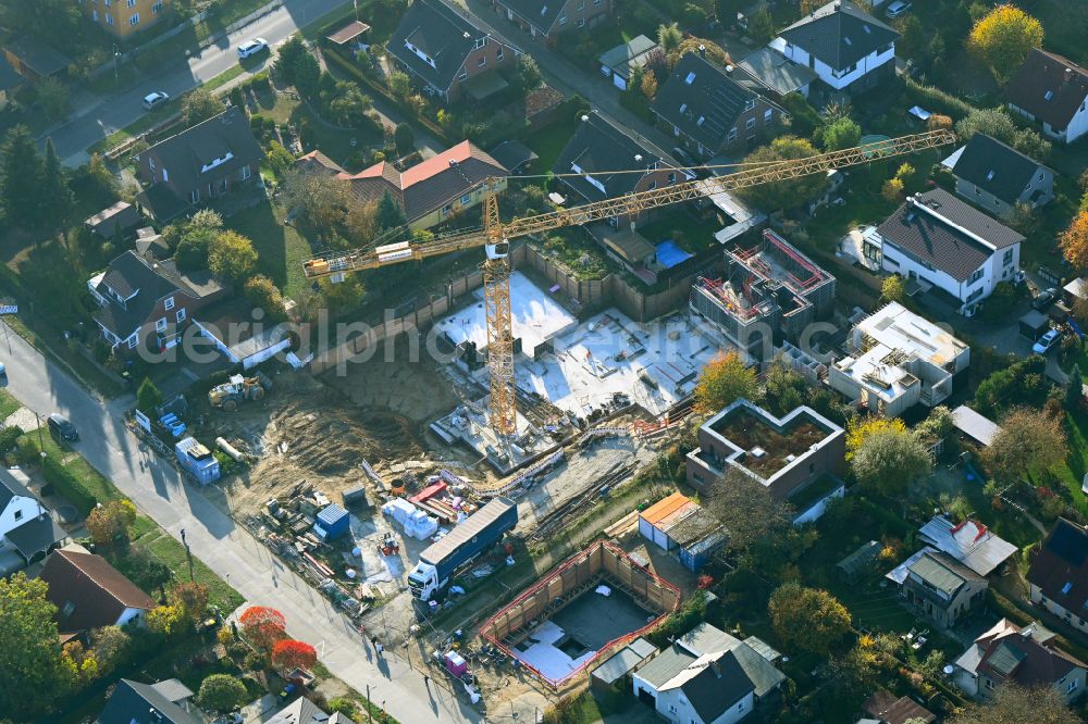 Aerial photograph Berlin - Construction site for the new construction of a multi-family residential building as a townhouse on street Neuenhagener Strasse in the district Mahlsdorf in Berlin, Germany