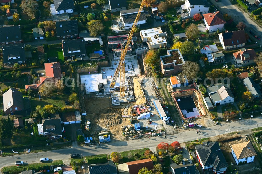 Berlin from above - Construction site for the new construction of a multi-family residential building as a townhouse on street Neuenhagener Strasse in the district Mahlsdorf in Berlin, Germany