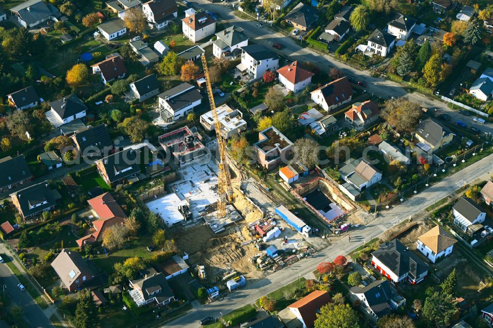 Berlin from the bird's eye view: Construction site for the new construction of a multi-family residential building as a townhouse on street Neuenhagener Strasse in the district Mahlsdorf in Berlin, Germany