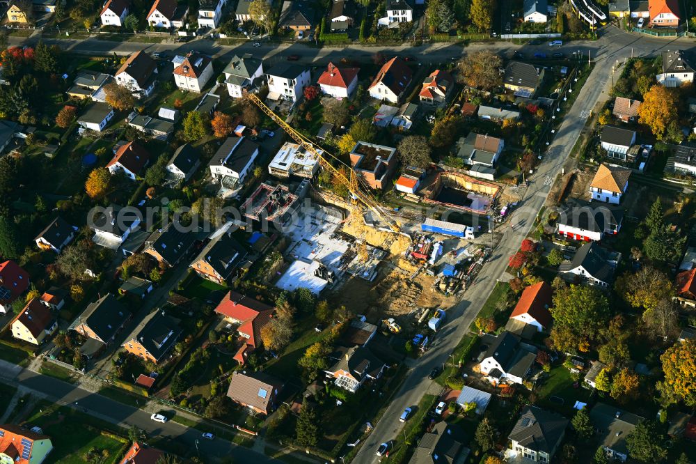 Aerial image Berlin - Construction site for the new construction of a multi-family residential building as a townhouse on street Neuenhagener Strasse in the district Mahlsdorf in Berlin, Germany