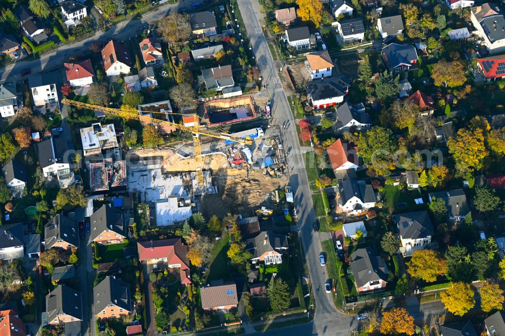 Berlin from above - Construction site for the new construction of a multi-family residential building as a townhouse on street Neuenhagener Strasse in the district Mahlsdorf in Berlin, Germany