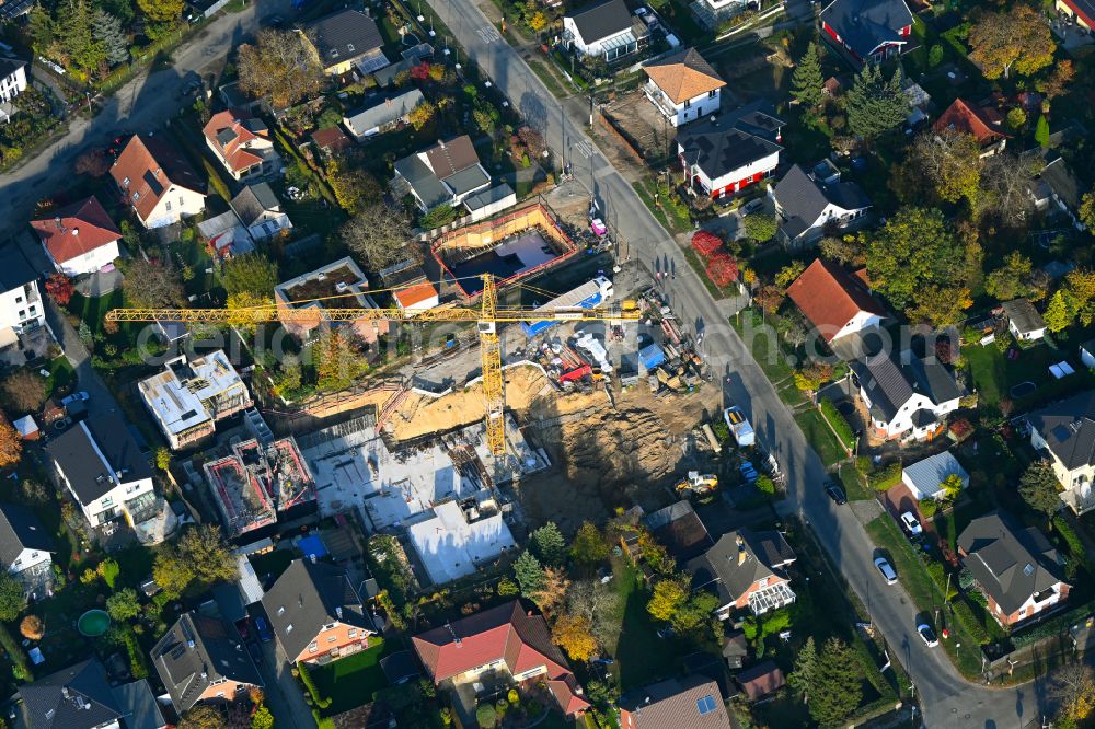 Berlin from the bird's eye view: Construction site for the new construction of a multi-family residential building as a townhouse on street Neuenhagener Strasse in the district Mahlsdorf in Berlin, Germany