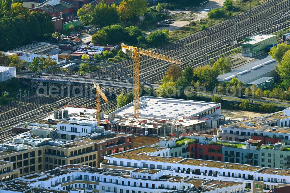 Berlin from the bird's eye view: Construction site for the new building of a store of the supermarket REWE on street Revaler Strasse in the district Friedrichshain in Berlin, Germany