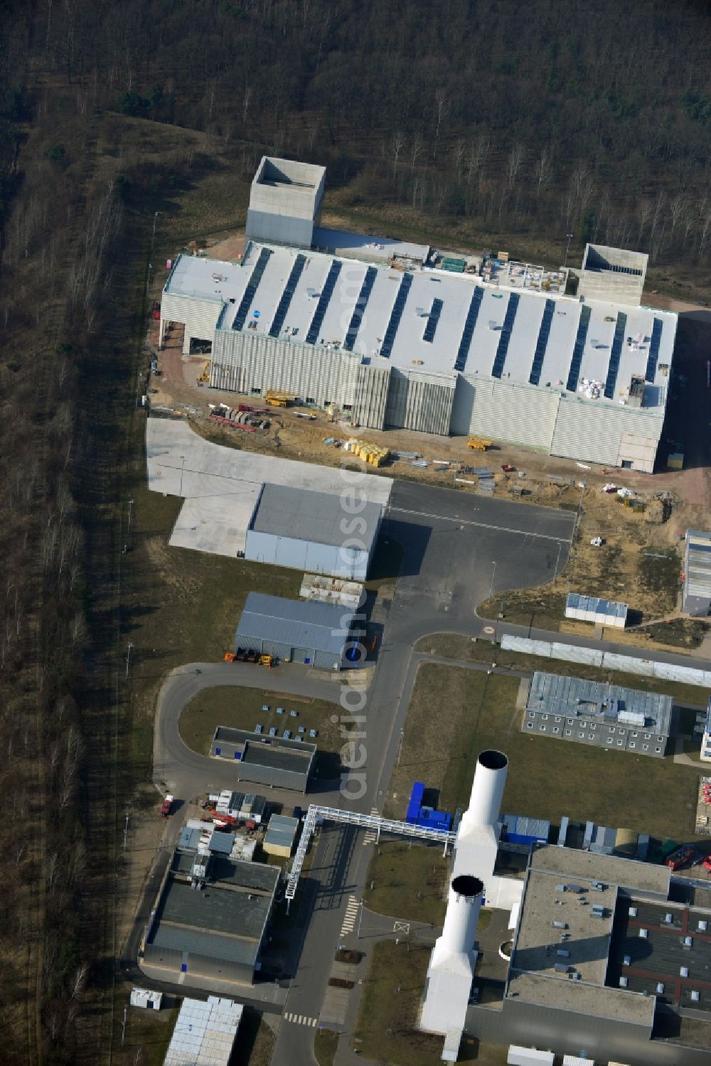 Dahlewitz from the bird's eye view: Construction site to build a new engine test stand at the Rolls Royce plant in Dahlewitz in Brandenburg