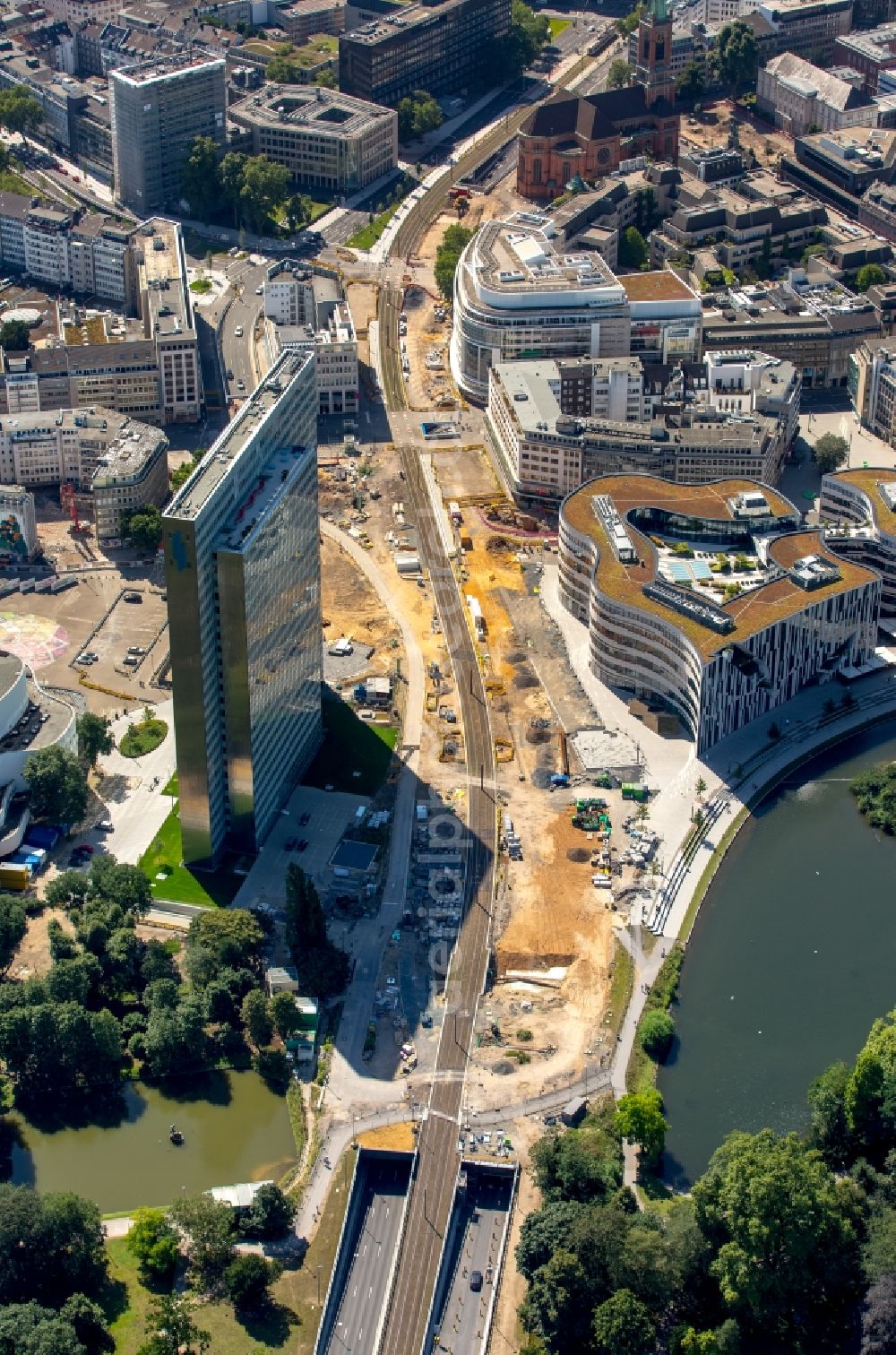 Düsseldorf from the bird's eye view: Construction for the new building of the Koe- tunnel at the skyscraper Dreischeibenhaus along Berliner Allee in Dusseldorf in North Rhine-Westphalia