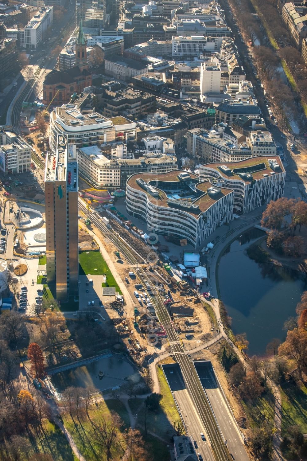 Düsseldorf from the bird's eye view: Construction for the new building of the Koe- tunnel at the skyscraper Dreischeibenhaus along Berliner Allee in Dusseldorf in North Rhine-Westphalia