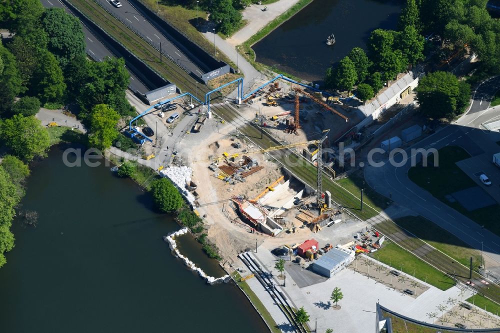 Düsseldorf from the bird's eye view: Construction for the new building of the Koe- tunnel at the skyscraper Dreischeibenhaus along Berliner Allee in Dusseldorf in North Rhine-Westphalia