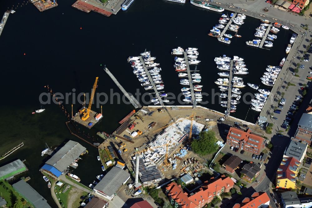 Waren (Müritz) from the bird's eye view: Construction site for the new building and reconstruction of the city port - marina at Mueritz basic in Waren (Mueritz) in the state Mecklenburg - Western Pomerania