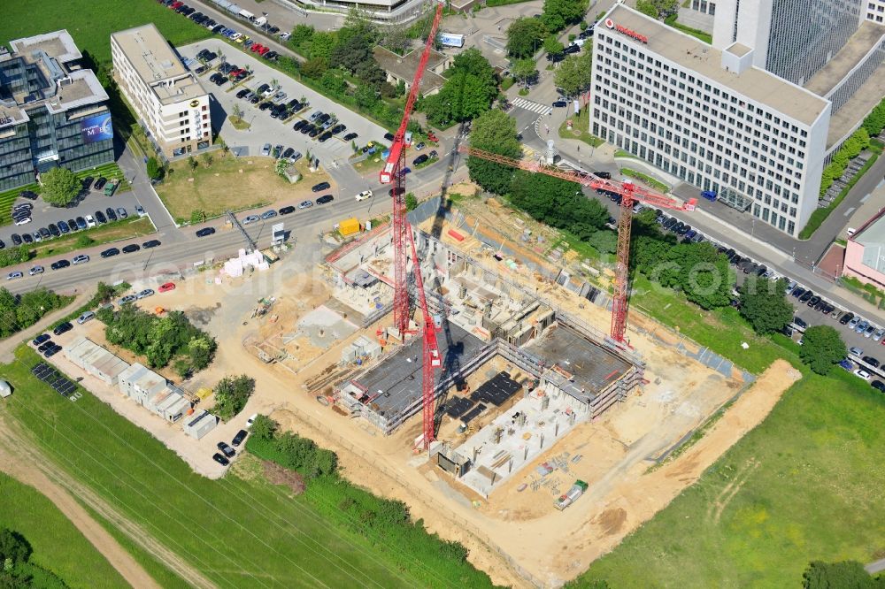 Frankfurt Main from above - View of the construction site to build a new sales and service center of the German Telekom in Eschborn in Frankfurt in Hesse. The building is designed by the architectural firm MEIXNER Schlüter Wendt Architekten with the project developer Lang & Cie.. built by the construction company Adolf Lupp GmbH + Co KG at the Wilhelm-Fay Street