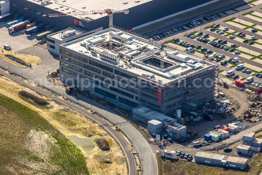 Aerial photograph Kamen - Construction site for the new construction of an administration building on the site of the new company headquarters of Woolworth GmbH in the industrial area Kamen Karree in Kamen in the state North Rhine-Westphalia, Germany