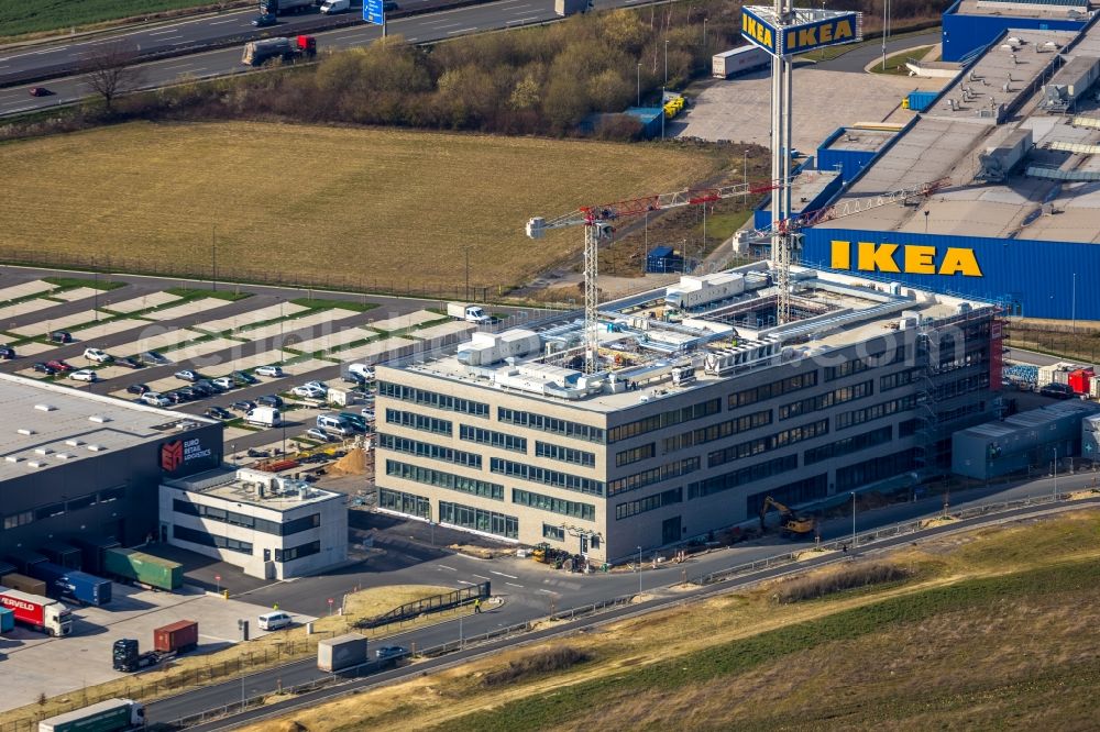 Aerial photograph Kamen - Construction site for the new construction of an administration building on the site of the new company headquarters of Woolworth GmbH in the industrial area Kamen Karree in Kamen in the state North Rhine-Westphalia, Germany