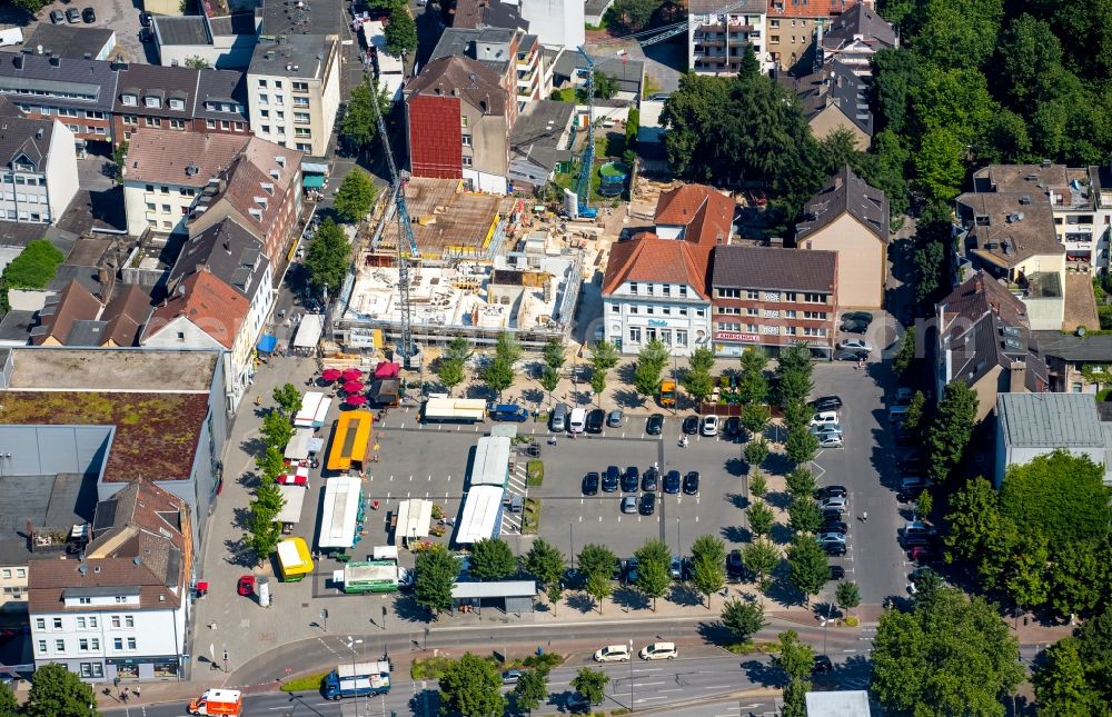 Aerial photograph Gladbeck - Construction site to build a new a four- to five-storey building complex with apartments on the market square in Gladbeck in North Rhine-Westphalia. The developer is company property Jockenhoefer u. Babiel according to the plans of Strelzig + Klump Dipl.-Ing. Architects AKNW