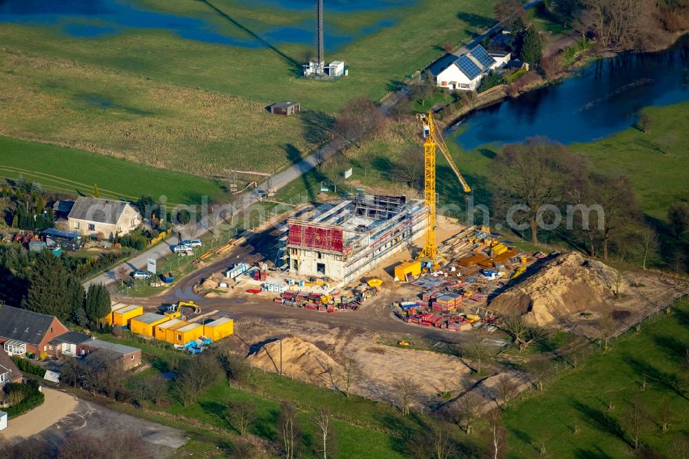 Emmerich am Rhein from the bird's eye view: Construction site for the new building of the waterworks in an agricultural field in Emmerich am Rhein in the state of North Rhine-Westphalia