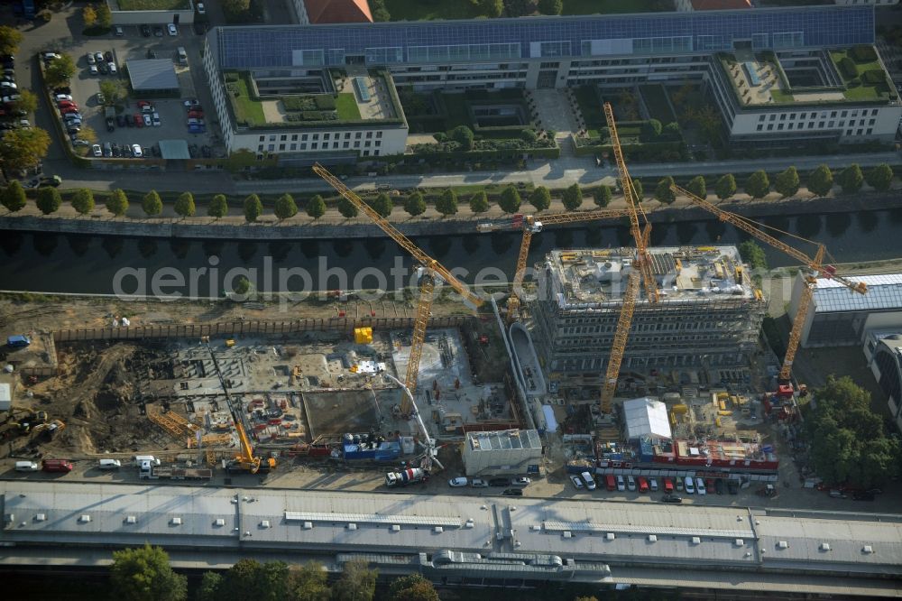 Aerial photograph Berlin - Construction site for the new building of a residential and office building in Europacity on Heidestrasse in Berlin in Germany. The shorter building is an office building of Ernst Basler + Partner AG, the longer one will be a residential building of Groth Gruppe