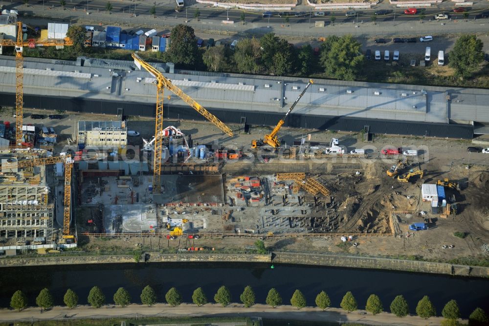 Aerial photograph Berlin - Construction site for the new building of a residential and office building in Europacity on Heidestrasse in Berlin in Germany. The shorter building is an office building of Ernst Basler + Partner AG, the longer one will be a residential building of Groth Gruppe