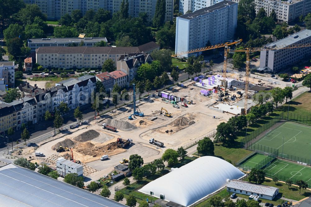 Berlin from above - Construction site for the new residential and commercial building on street Konrad-Wolf-Strasse in the district Hohenschoenhausen in Berlin, Germany