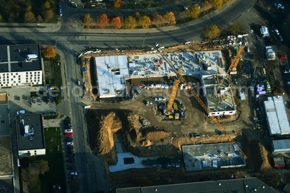 Aerial photograph Berlin - Construction site for the new residential and commercial building on the Albert-Kuntz-Strasse corner Louis-Lewin-Strasse - Adele-Sandrock-Strasse in the district Hellersdorf in Berlin, Germany