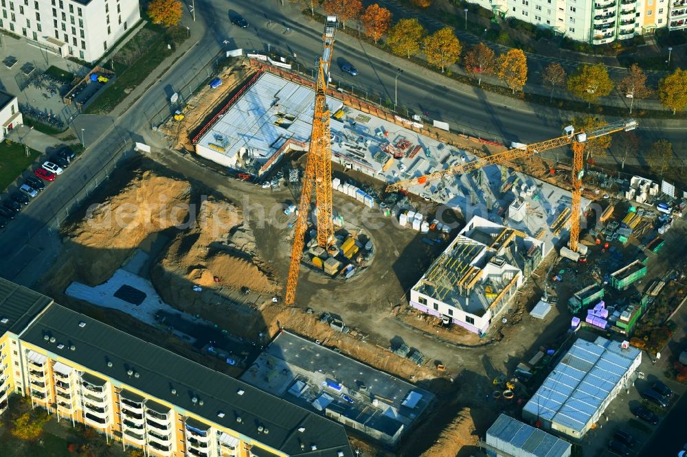 Berlin from the bird's eye view: Construction site for the new residential and commercial building on the Albert-Kuntz-Strasse corner Louis-Lewin-Strasse - Adele-Sandrock-Strasse in the district Hellersdorf in Berlin, Germany