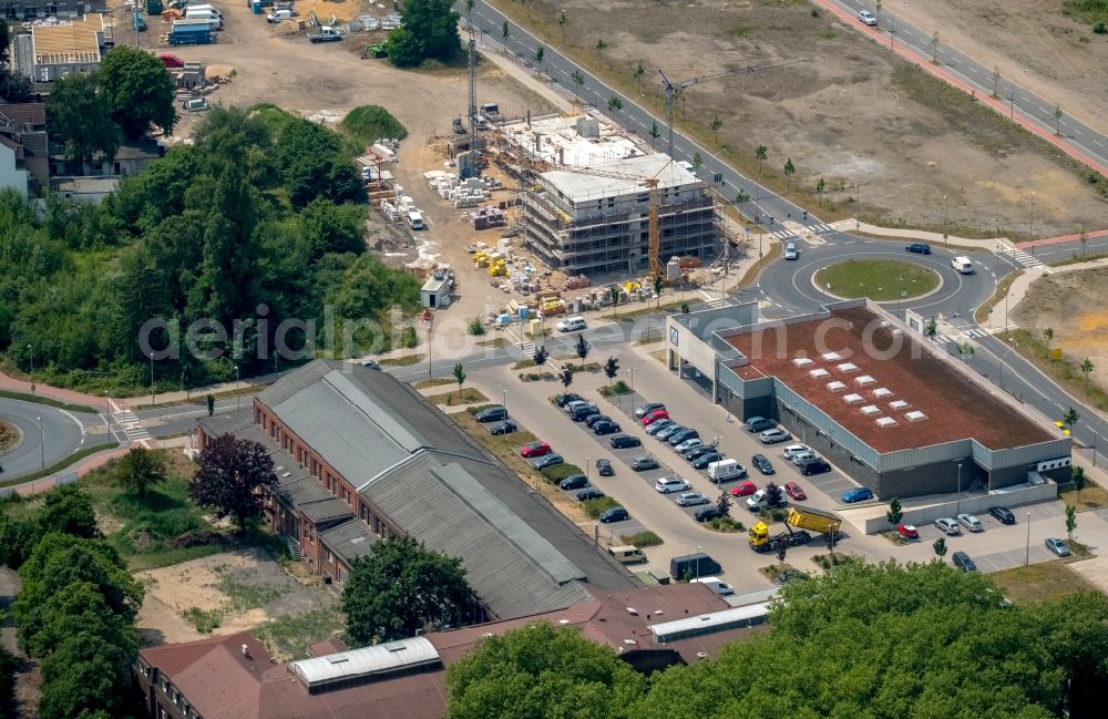 Dorsten from the bird's eye view: Construction site for the new residential and commercial building on the Fuerst-Leopold-Allee in Dorsten in the state North Rhine-Westphalia, Germany