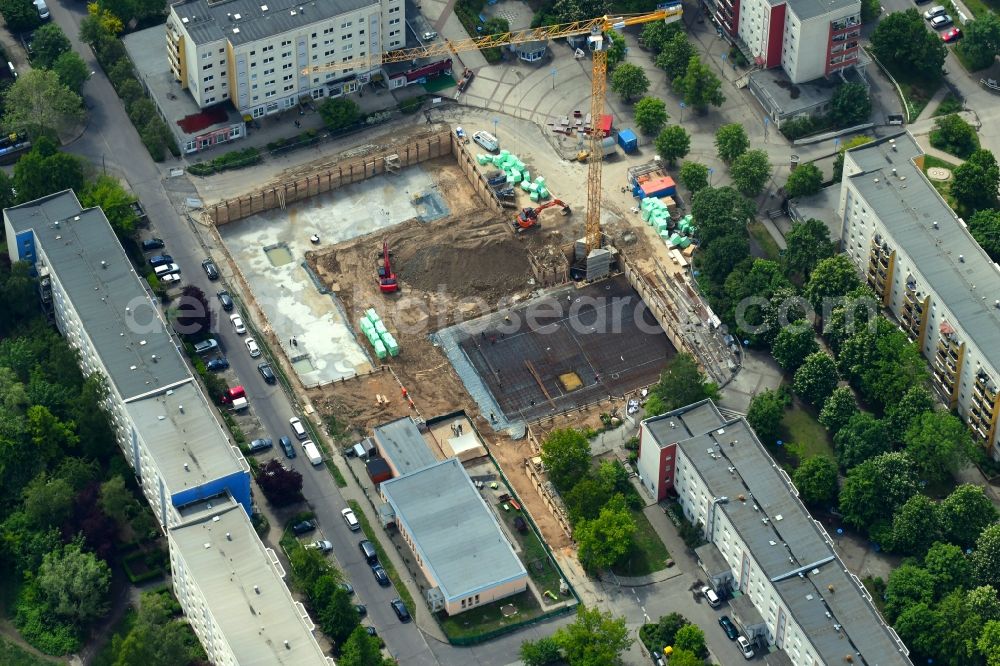 Berlin from the bird's eye view: Construction site for the new residential and commercial building on Kastanienboulevard - Auerbacher Ring - Schneeberger Strasse in the district Hellersdorf in Berlin, Germany