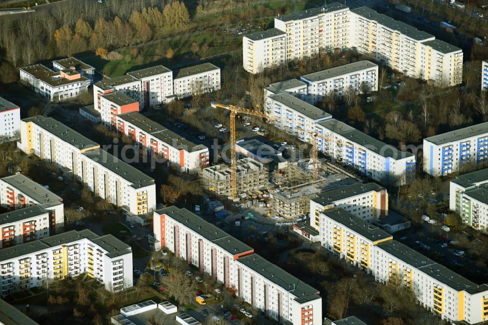 Berlin from the bird's eye view: Construction site for the new residential and commercial building on Kastanienboulevard - Auerbacher Ring - Schneeberger Strasse in the district Hellersdorf in Berlin, Germany