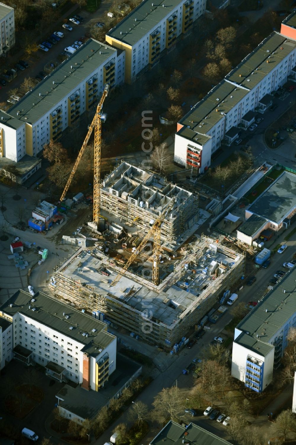 Berlin from the bird's eye view: Construction site for the new residential and commercial building on Kastanienboulevard - Auerbacher Ring - Schneeberger Strasse in the district Hellersdorf in Berlin, Germany