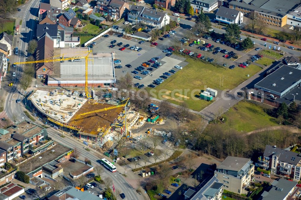 Aerial photograph Kirchhellen - Construction site for the new building of a residential and business building in the center of Kirchhellen in the state of North Rhine-Westphalia