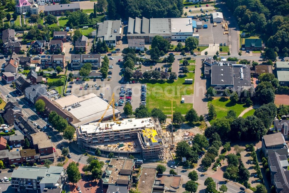 Kirchhellen from above - Construction site for the new building of a residential and business building in the center of Kirchhellen in the state of North Rhine-Westphalia