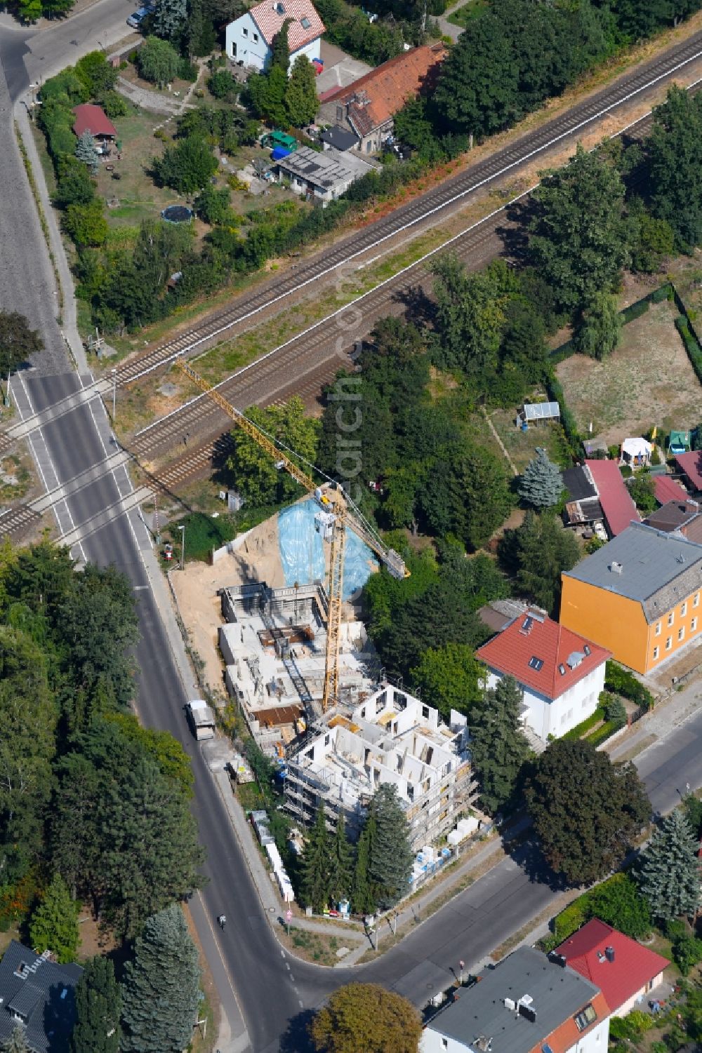 Aerial image Berlin - Construction site for the new residential and commercial building on the on Lemkestrasse corner Donizettistrasse in the district Mahlsdorf in Berlin, Germany