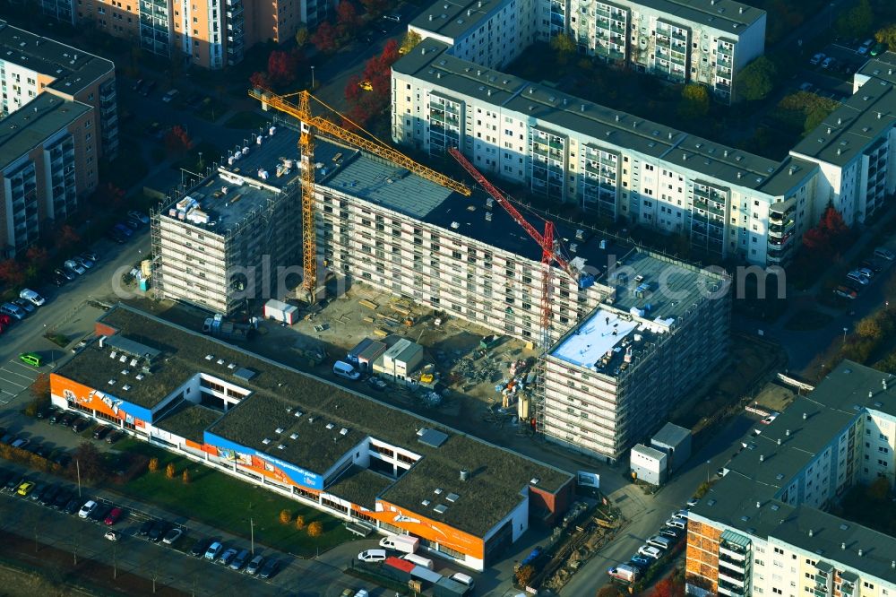 Aerial image Berlin - Construction site for the new residential and commercial building on the Schkeuditzer Strasse - Boehlener Strasse in the district Hellersdorf in Berlin, Germany