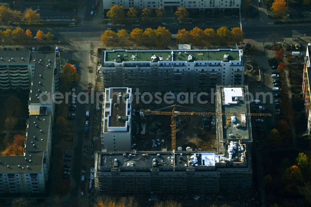 Berlin from the bird's eye view: Construction site for the new residential and commercial building on the Schwarzheider Strasse corner Louis-Lewin-Strasse - Forster Strasse in the district Hellersdorf in Berlin, Germany